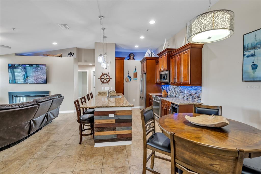 6420 Banyan Boulevard, Unit 303 New Port Richey, FL 34652 - Photo 4 of 54 a view of a dining room with furniture