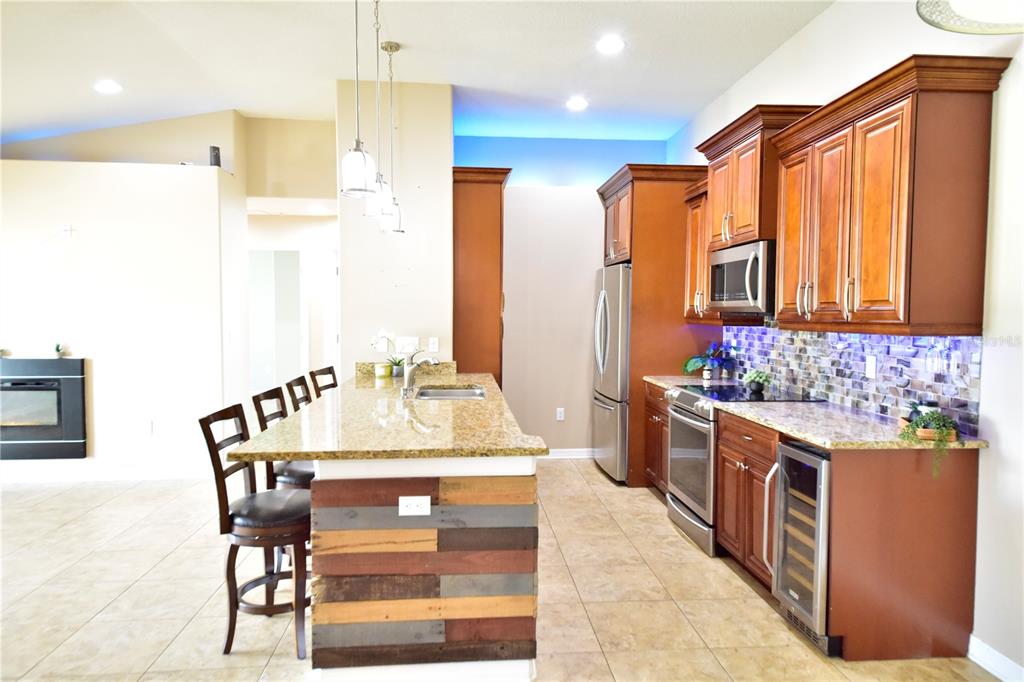 6420 Banyan Boulevard, Unit 303 New Port Richey, FL 34652 - Photo 6 of 54 a bathroom with a granite countertop sink and a mirror