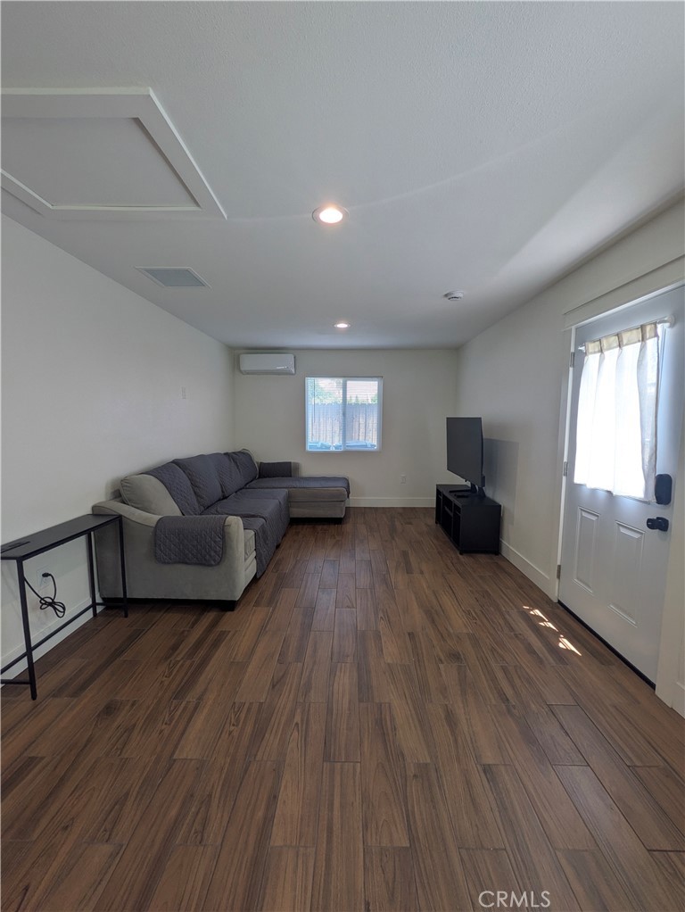4803 Beatty Drive Riverside, CA 92506 - Photo 2 of 5 a living room with furniture and a wooden floor