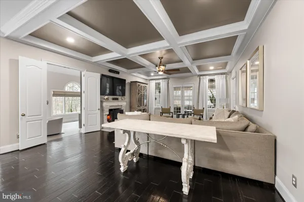 a bedroom with furniture and wooden floor