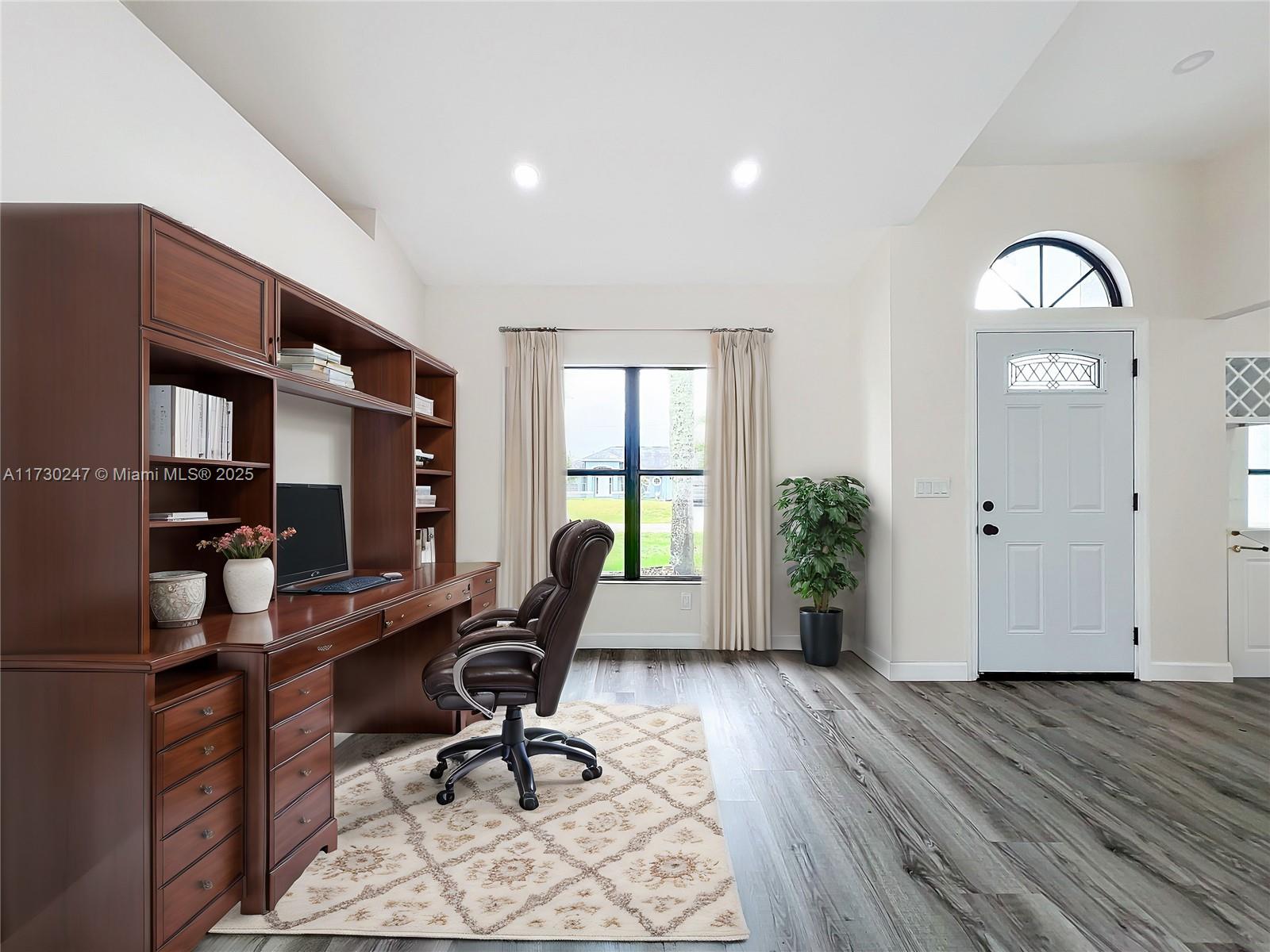 521 Southwest Rabbit Avenue Port St. Lucie, FL 34953 - Photo 17 of 45 a view of a workspace with wooden floor and a window