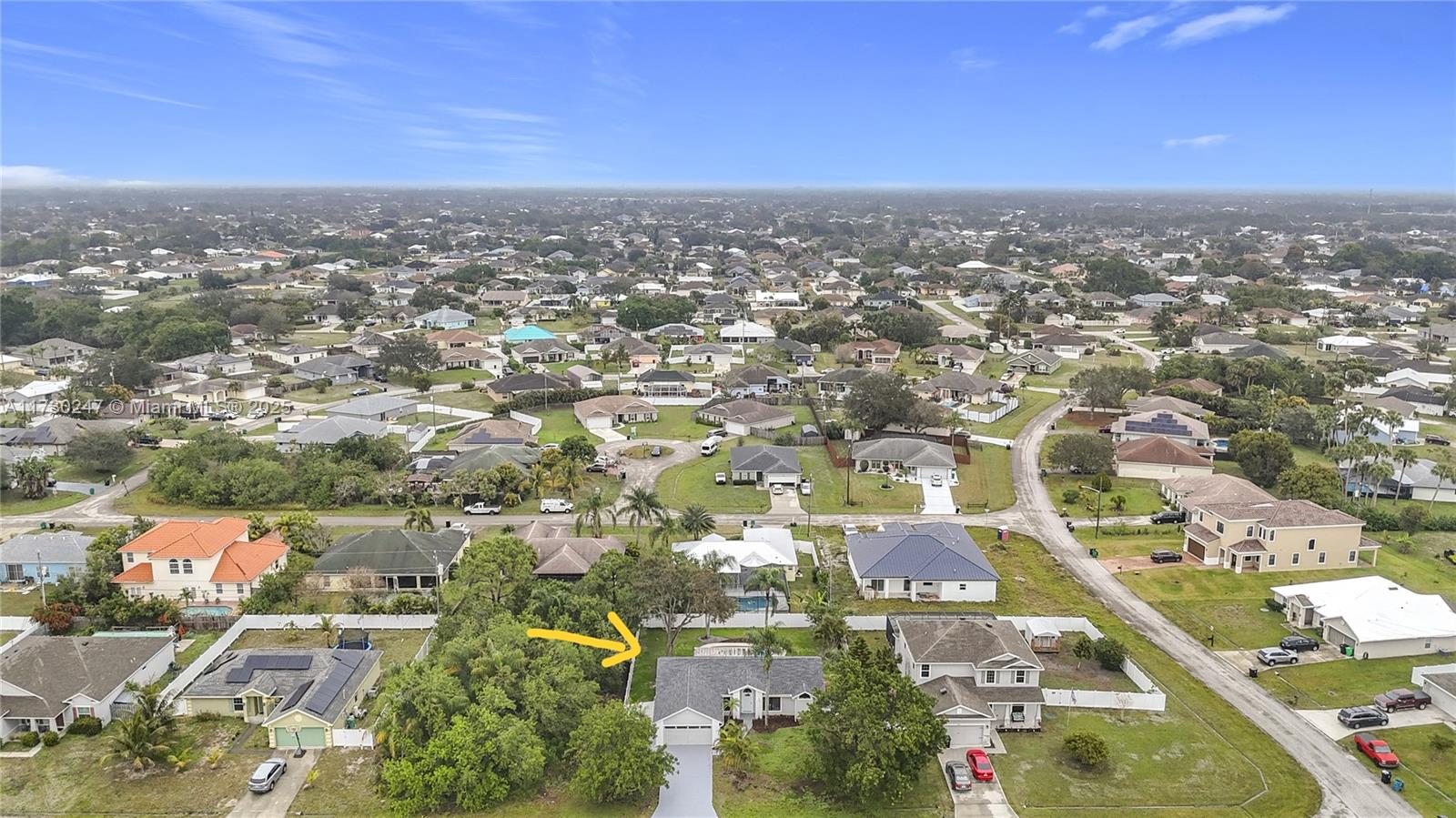 521 Southwest Rabbit Avenue Port St. Lucie, FL 34953 - Photo 3 of 45 an aerial view of residential building with green space
