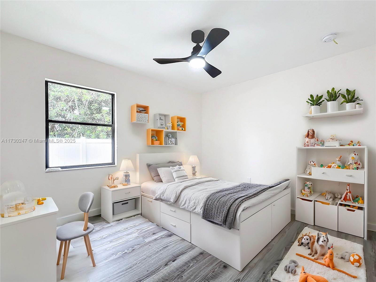 521 Southwest Rabbit Avenue Port St. Lucie, FL 34953 - Photo 41 of 45 a bedroom with a bed and a window
