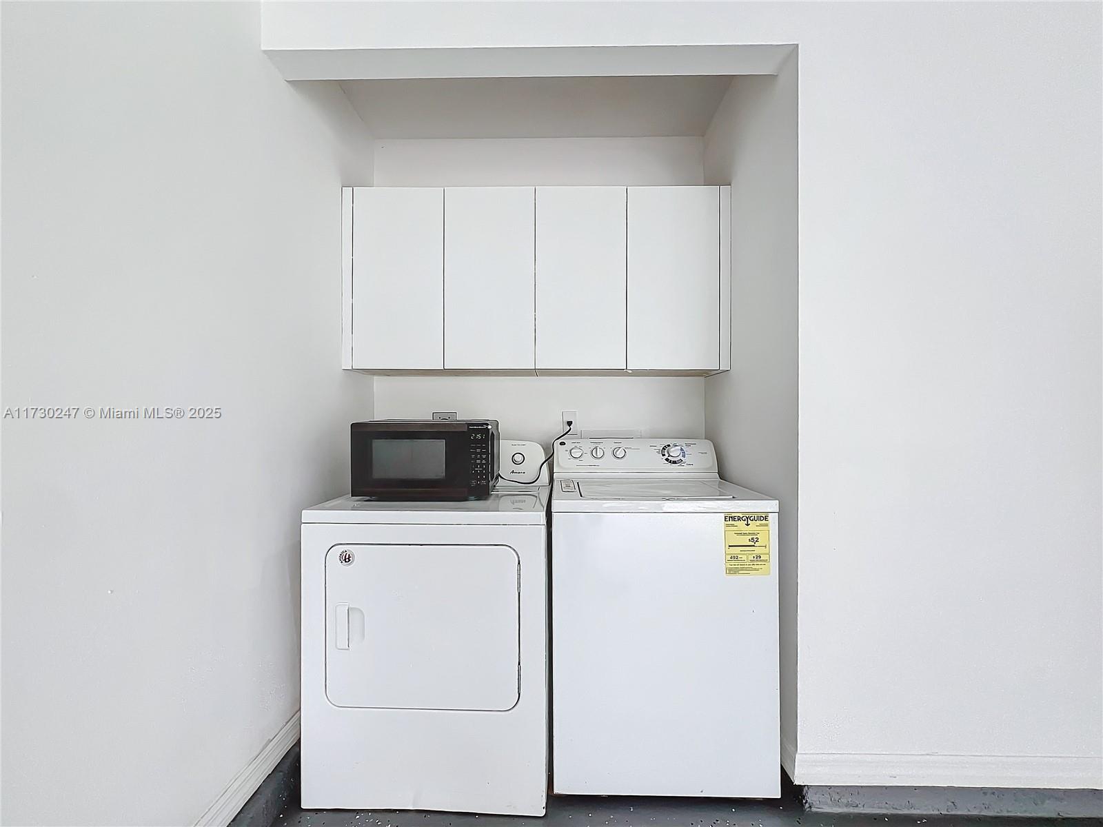 521 Southwest Rabbit Avenue Port St. Lucie, FL 34953 - Photo 44 of 45 a utility room with dryer and washer