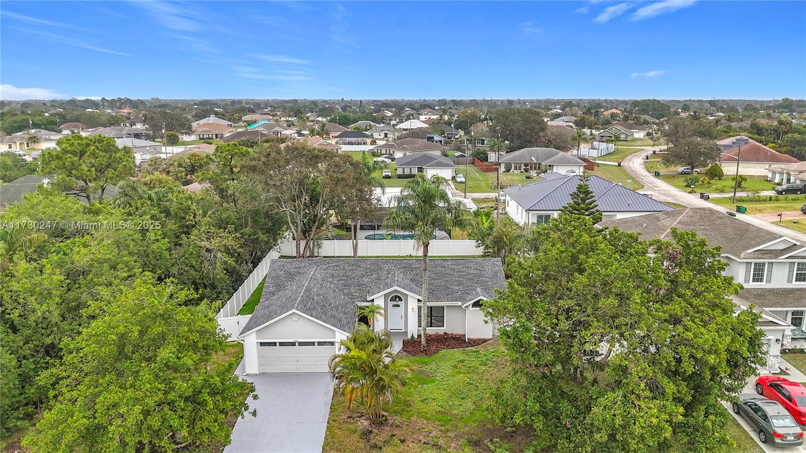 521 Southwest Rabbit Avenue Port St. Lucie, FL 34953 - Photo 6 of 45 an aerial view of residential houses with outdoor space