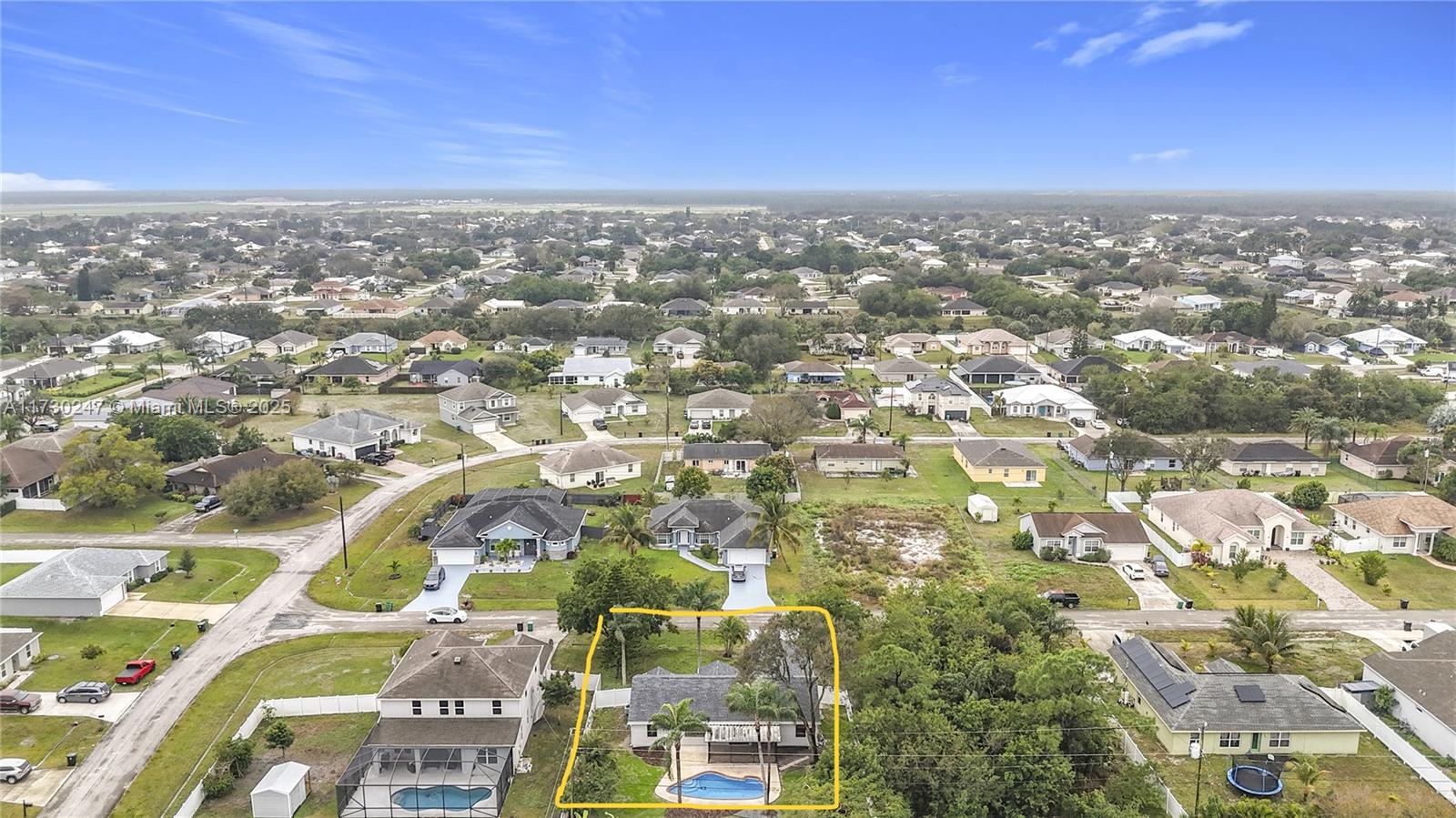 521 Southwest Rabbit Avenue Port St. Lucie, FL 34953 - Photo 7 of 45 an aerial view of residential building and trees