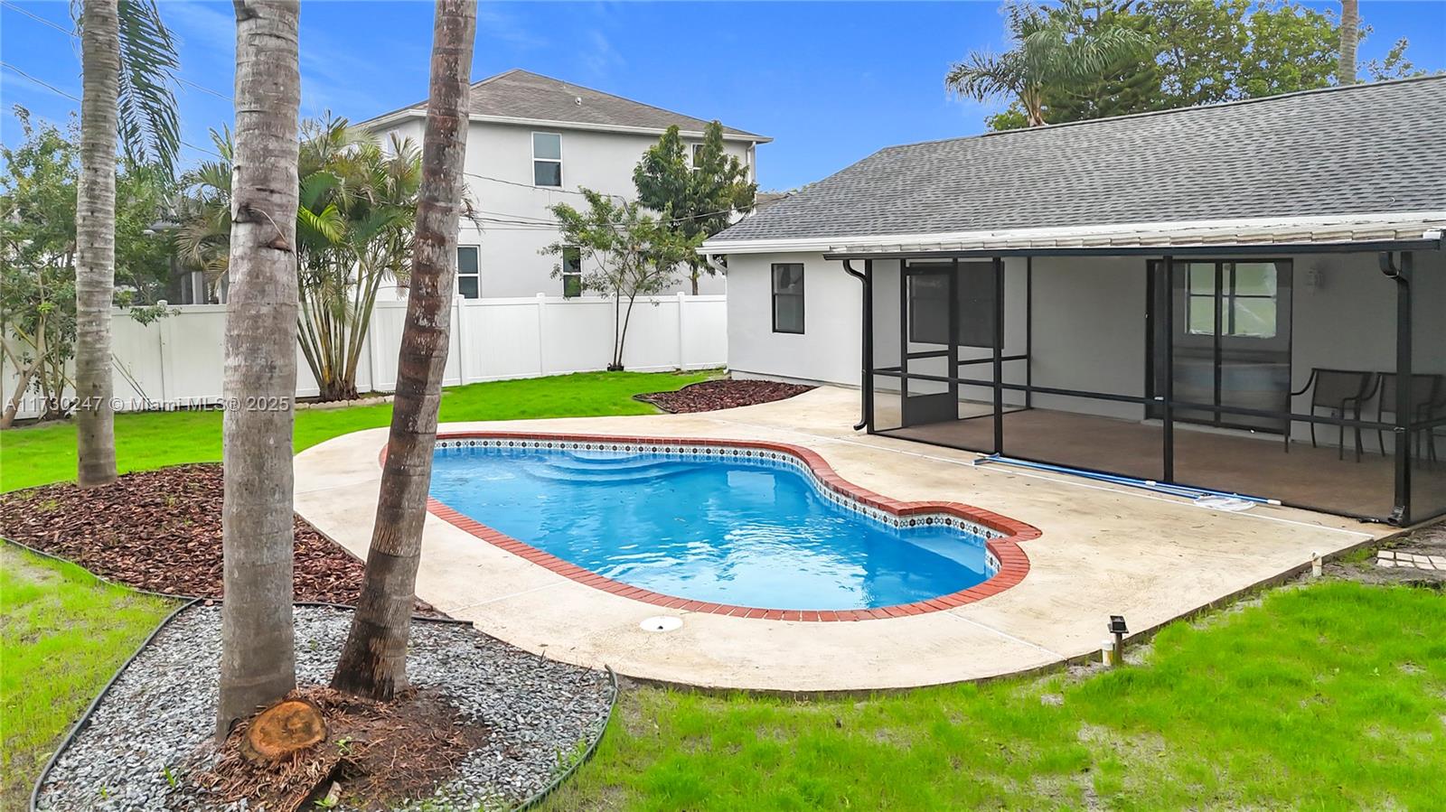 521 Southwest Rabbit Avenue Port St. Lucie, FL 34953 - Photo 9 of 45 a house view with a swimming pool