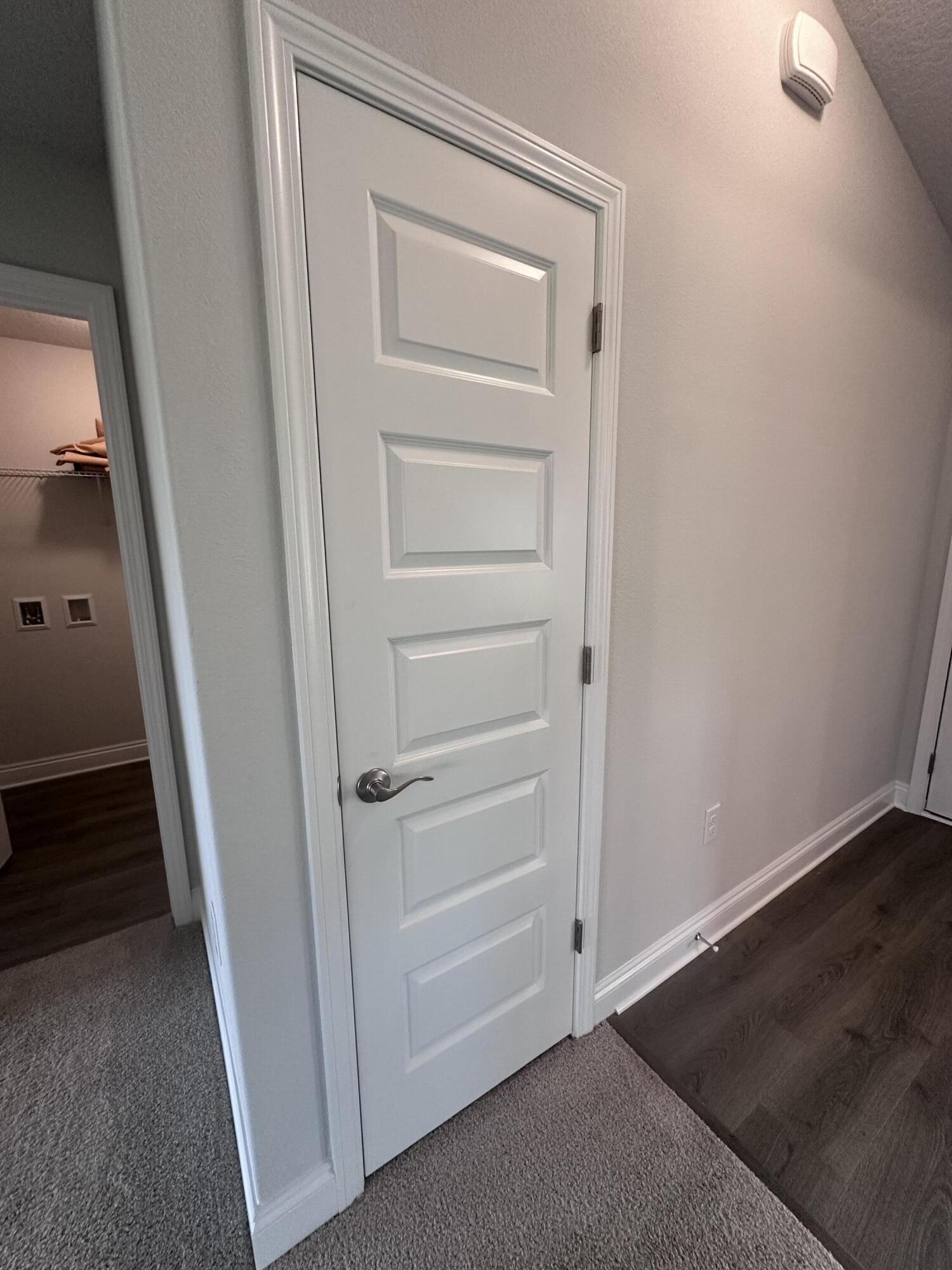 6114 Buckshot Drive Crestview, FL 32539 - Photo 11 of 22 an empty room with a wooden door