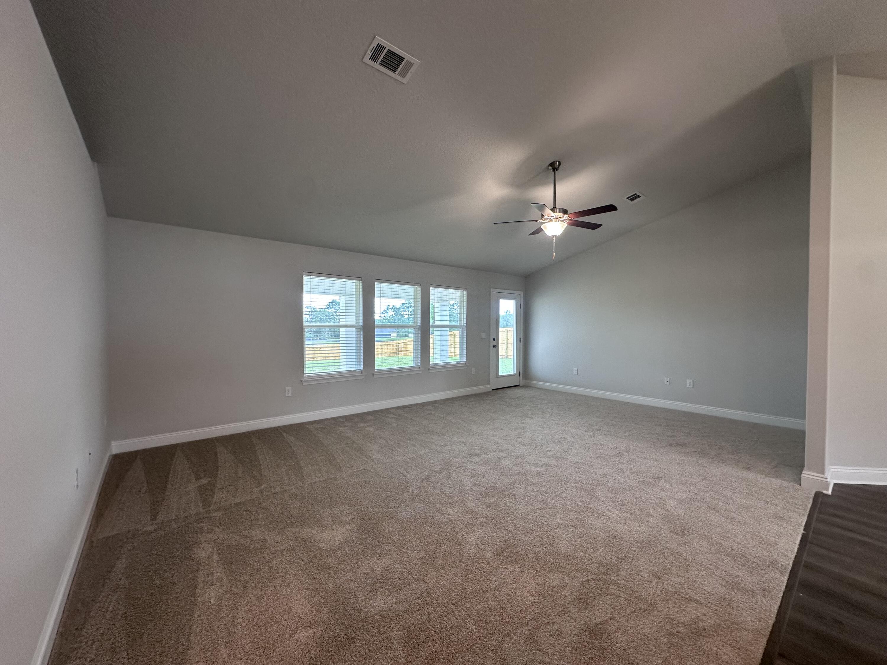 6114 Buckshot Drive Crestview, FL 32539 - Photo 17 of 22 wooden floor in an empty room with a window