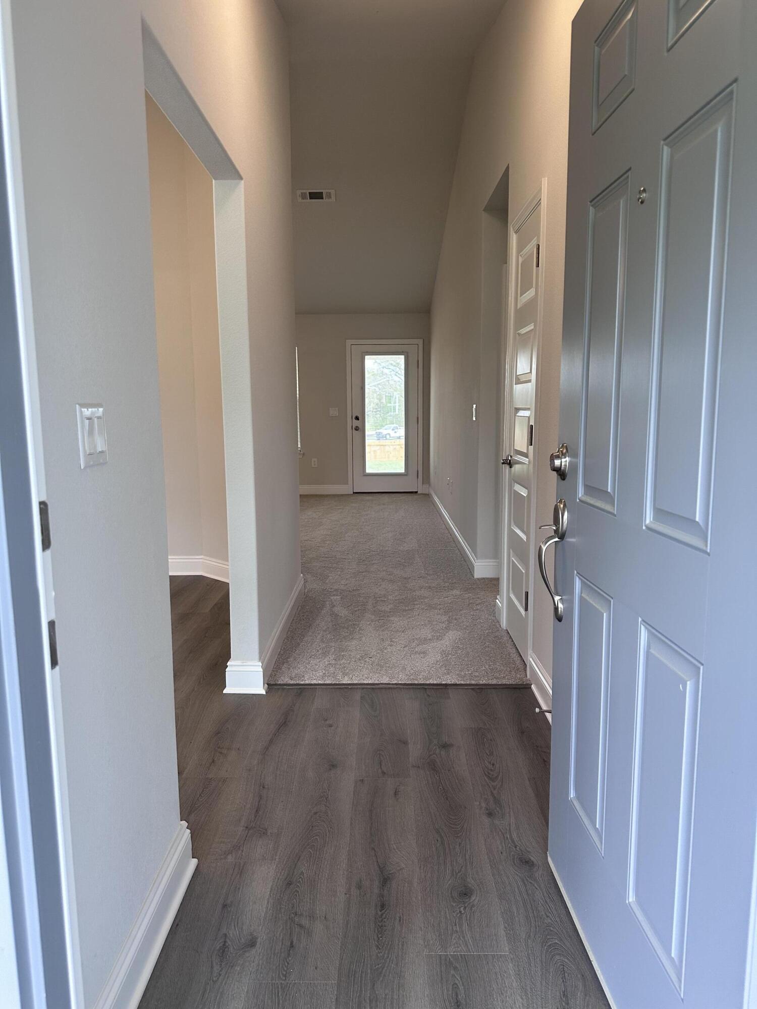 6114 Buckshot Drive Crestview, FL 32539 - Photo 21 of 22 wooden floor in a hall with an entryway