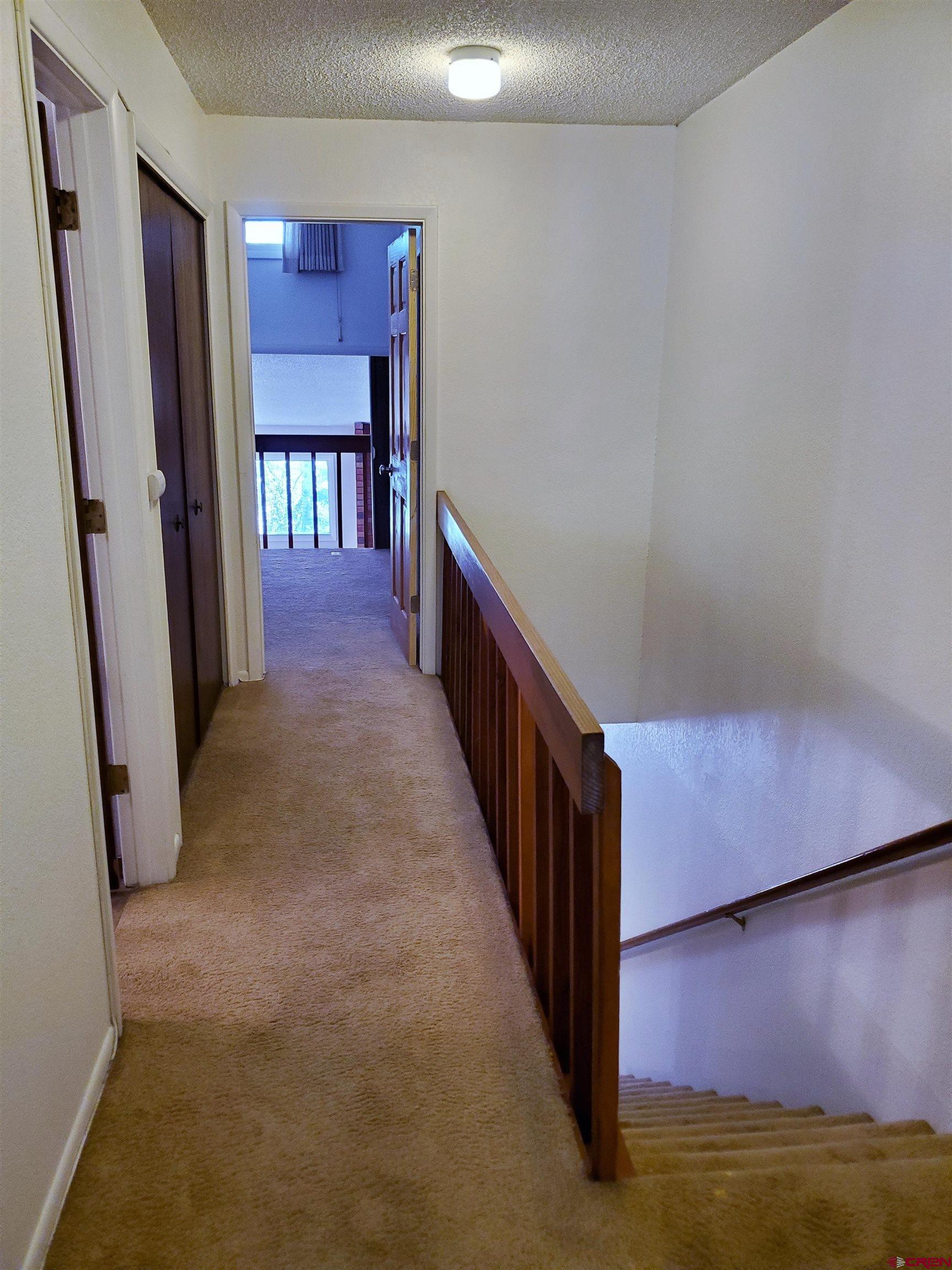 1825 Florida Road, Unit 103 Durango, CO 81301 - Photo 14 of 34 a view of a hallway with staircase
