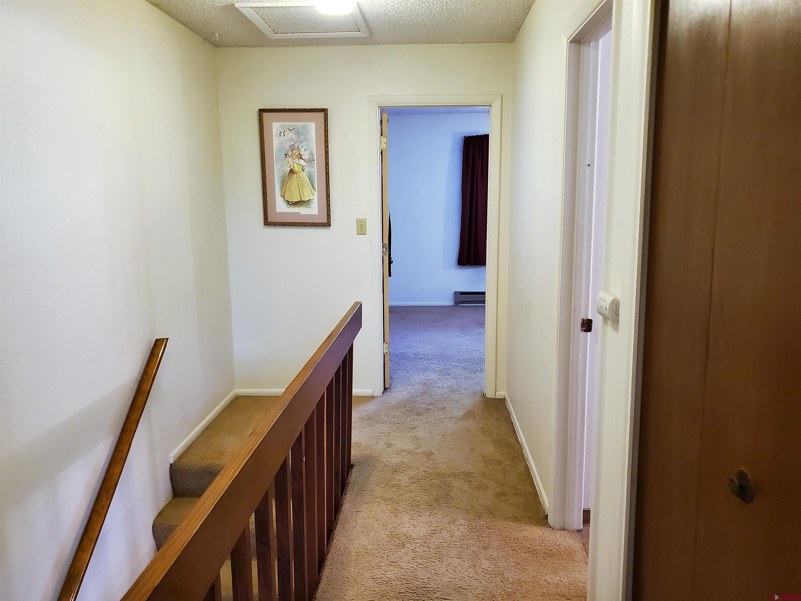 1825 Florida Road, Unit 103 Durango, CO 81301 - Photo 15 of 34 a view of a hallway with wooden floor