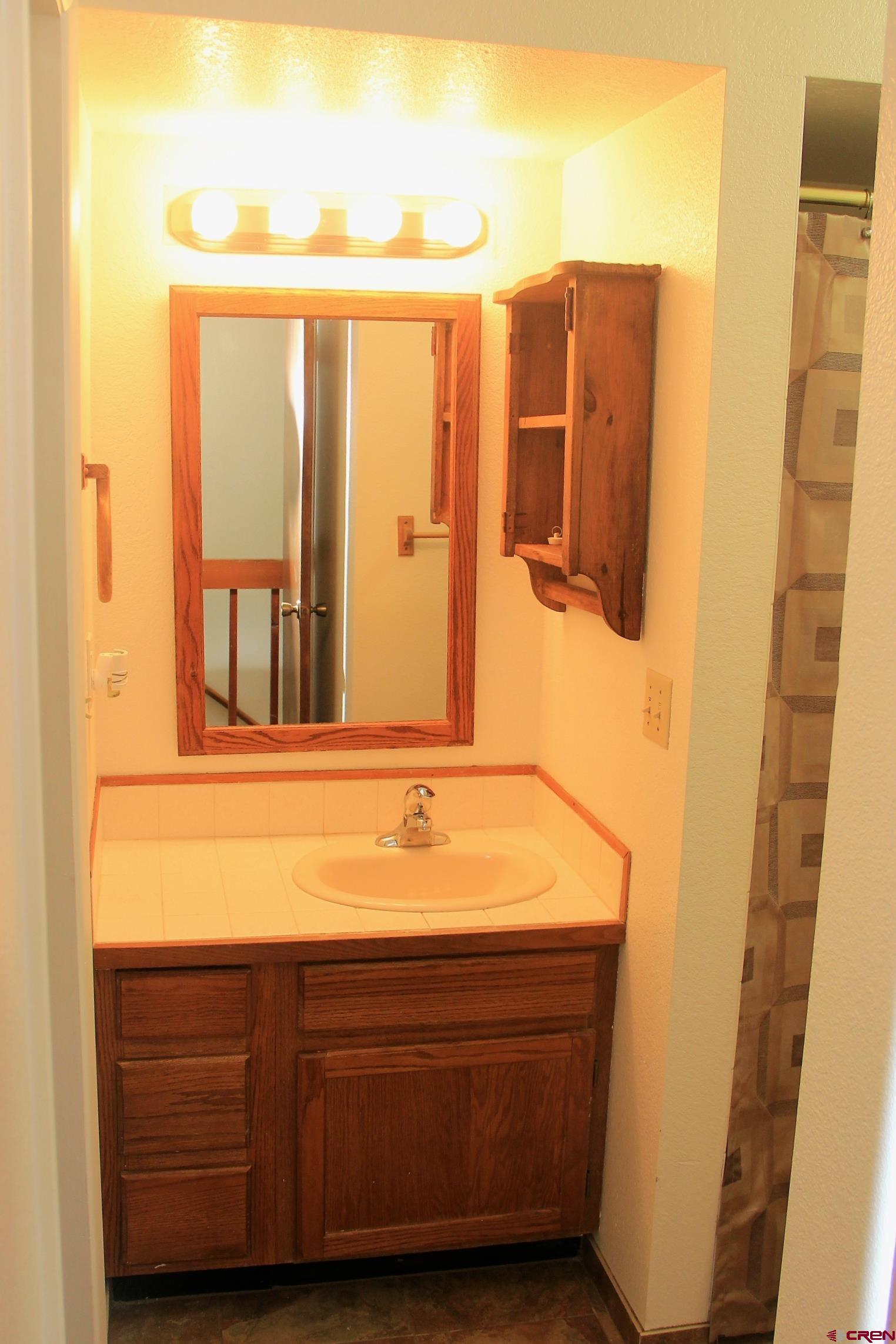1825 Florida Road, Unit 103 Durango, CO 81301 - Photo 19 of 34 a bathroom with a sink and a mirror