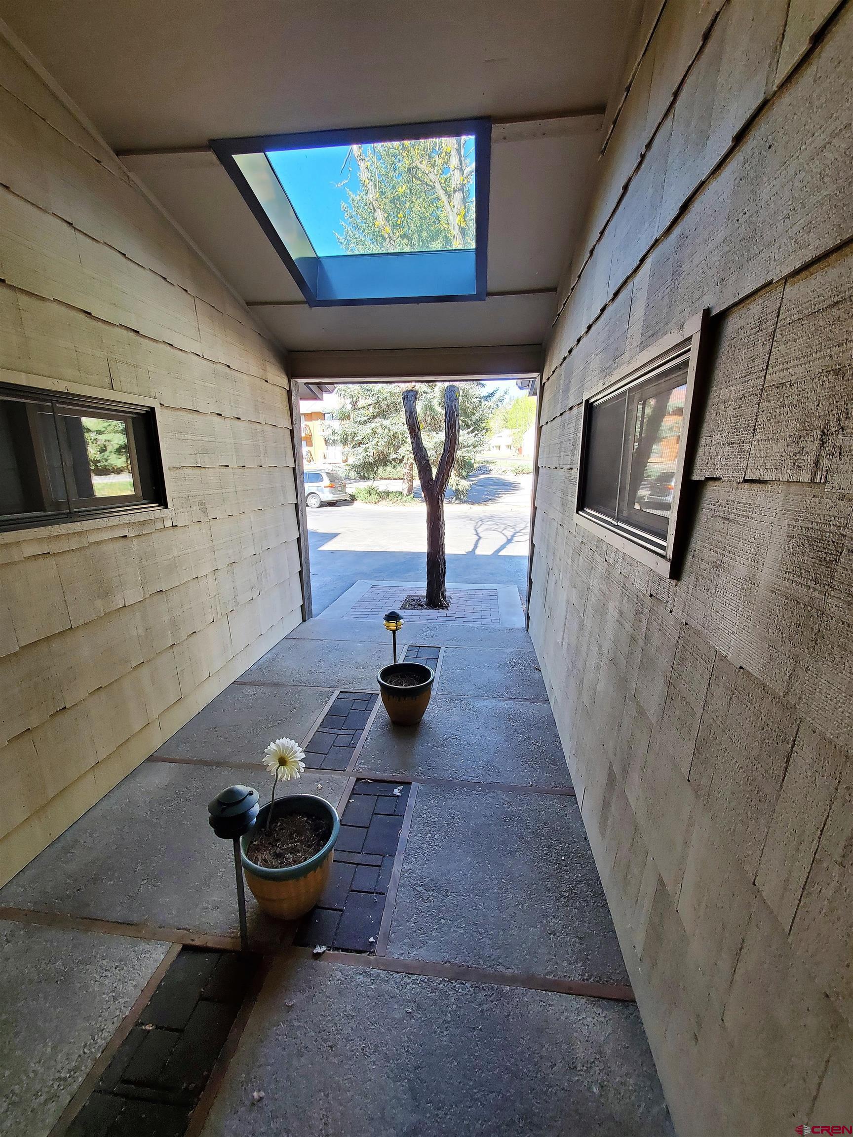 1825 Florida Road, Unit 103 Durango, CO 81301 - Photo 33 of 34 a living room with furniture and a floor to ceiling window