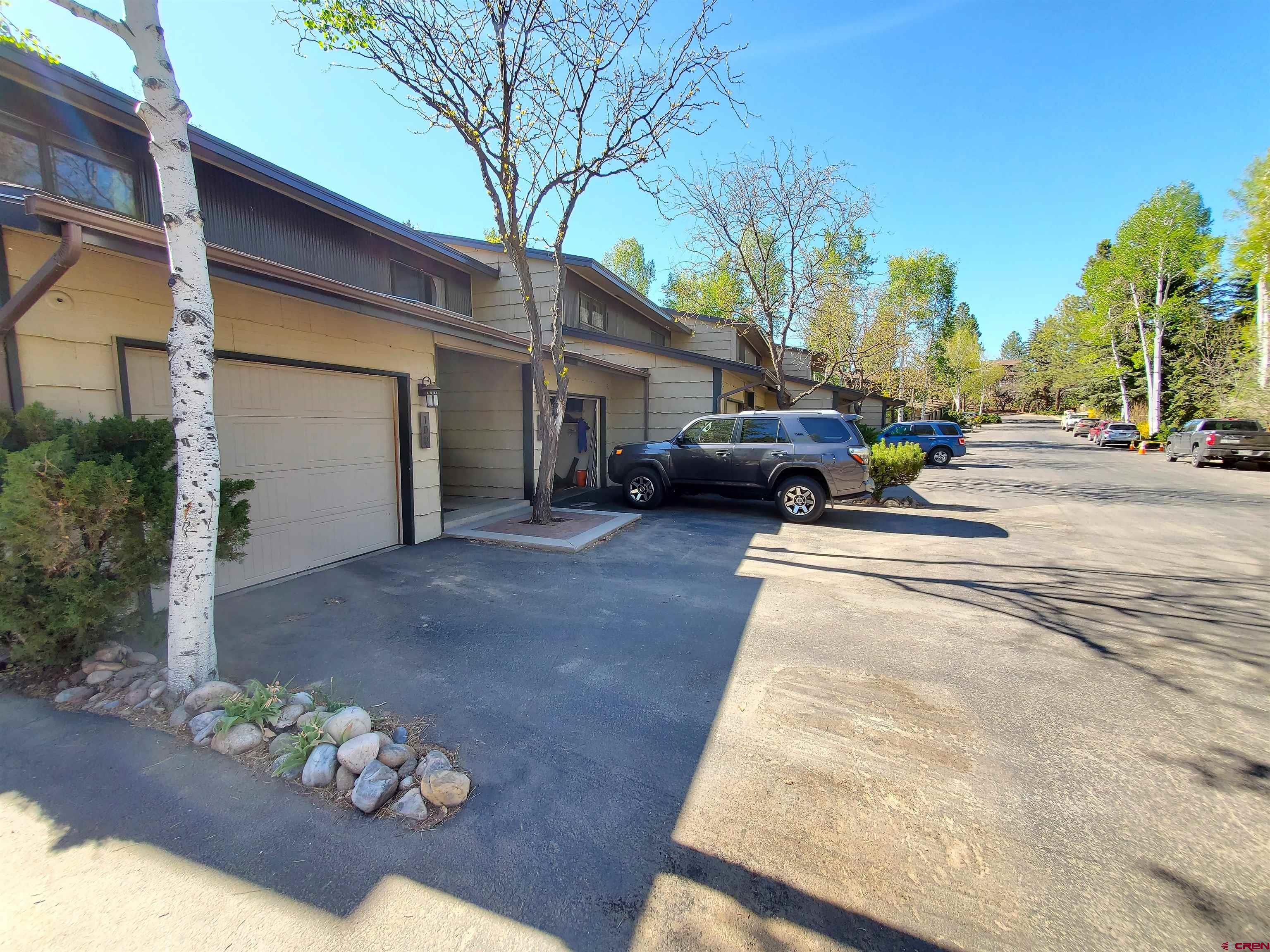 1825 Florida Road, Unit 103 Durango, CO 81301 - Photo 4 of 34 a view of a street with couple of cars parked in front of it