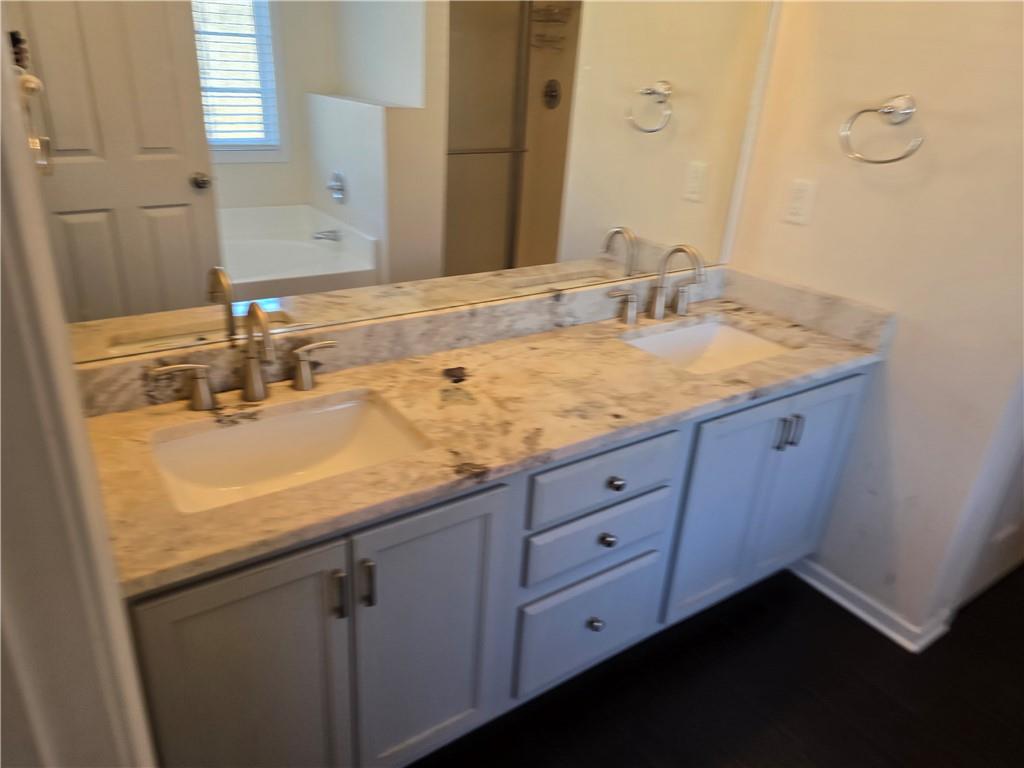 607 McDowell Lane Bethlehem, GA 30620 - Photo 12 of 22 a bathroom with a sink and a mirror