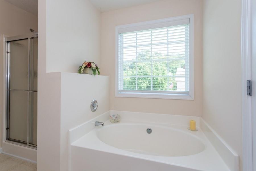607 McDowell Lane Bethlehem, GA 30620 - Photo 14 of 22 a white bath tub sitting next to a window