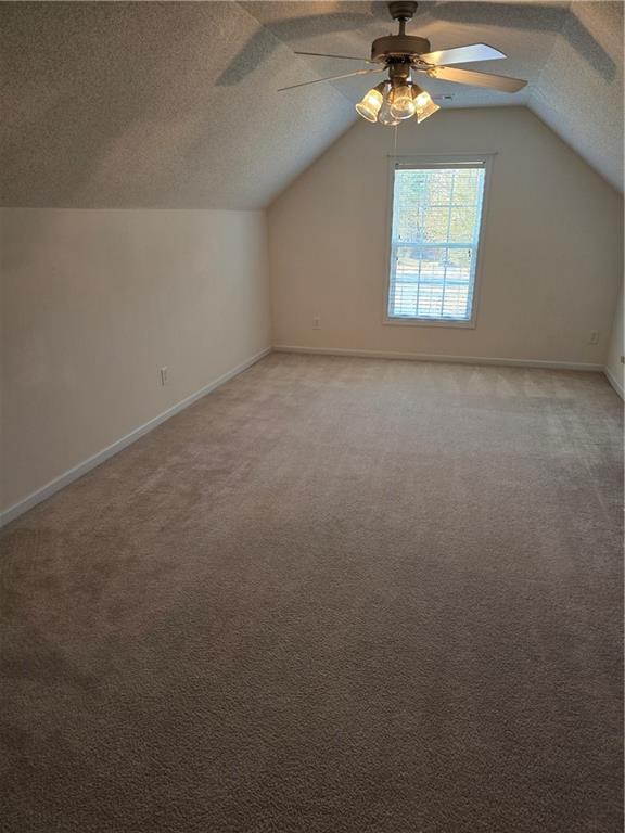 607 McDowell Lane Bethlehem, GA 30620 - Photo 16 of 22 an empty room with a chandelier fan and windows