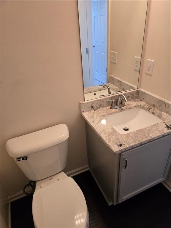607 McDowell Lane Bethlehem, GA 30620 - Photo 17 of 22 a bathroom with a granite countertop toilet sink and mirror