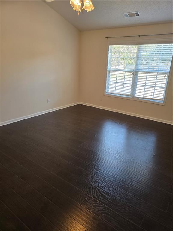 607 McDowell Lane Bethlehem, GA 30620 - Photo 10 of 22 an empty room with wooden floor and windows