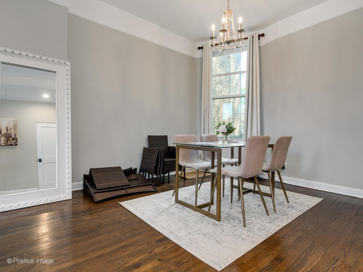 941 West Altgeld Street Chicago, IL 60614 - Photo 6 of 18 a dining room with wooden floor a chandelier a glass table and chairs