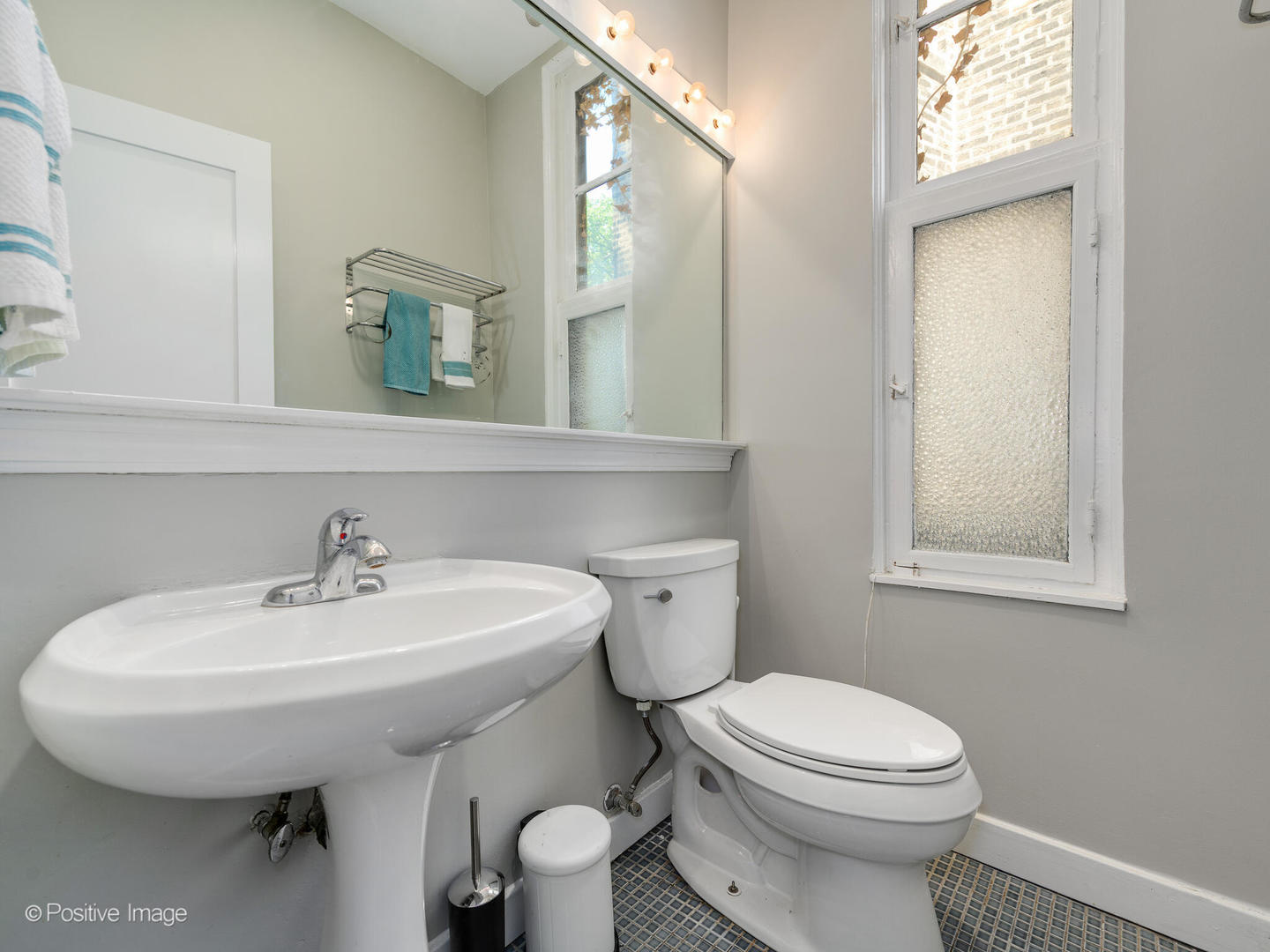 941 West Altgeld Street Chicago, IL 60614 - Photo 7 of 18 a bathroom with a sink a toilet and mirror