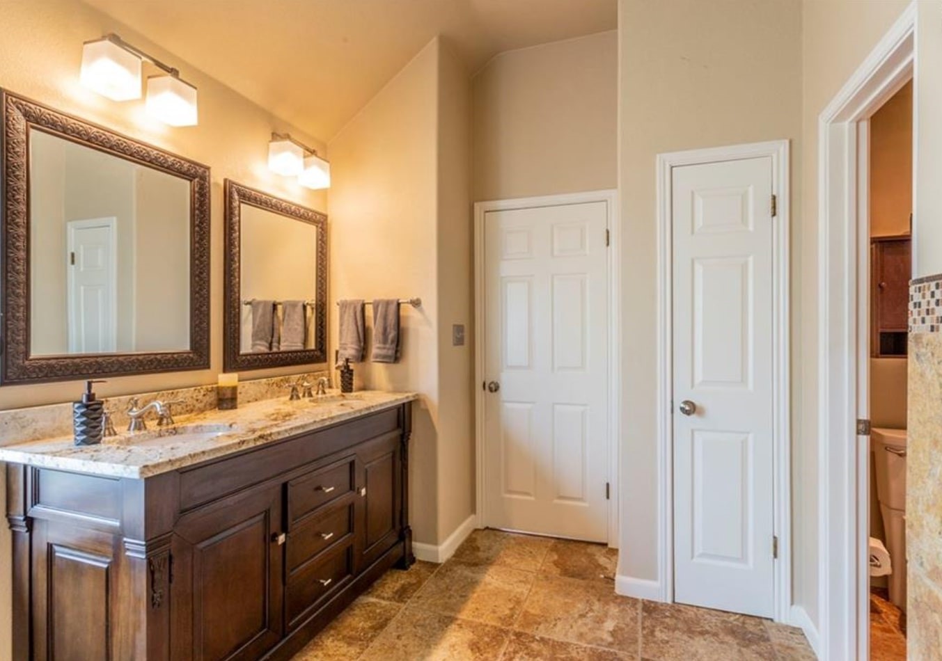 1100 Antelope Ridge Cedar Park, TX 78613 - Photo 14 of 24 a bathroom with a granite countertop sink and a mirror