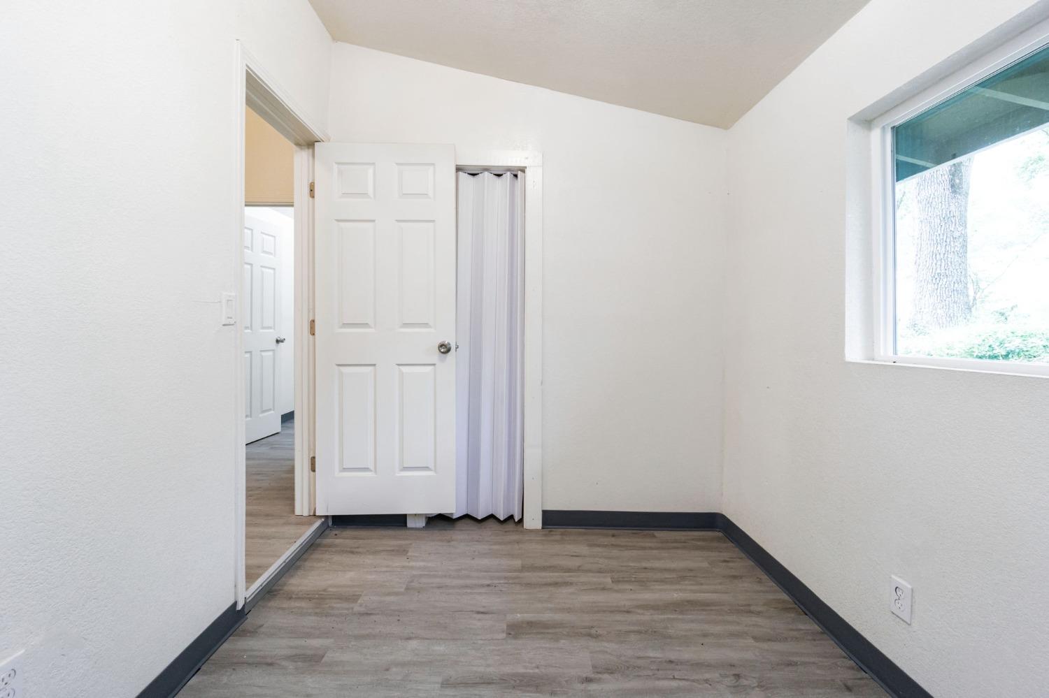 46801 Dunlap Road Miramonte, CA 93641 - Photo 11 of 28 a view of a room with wooden floor and windows