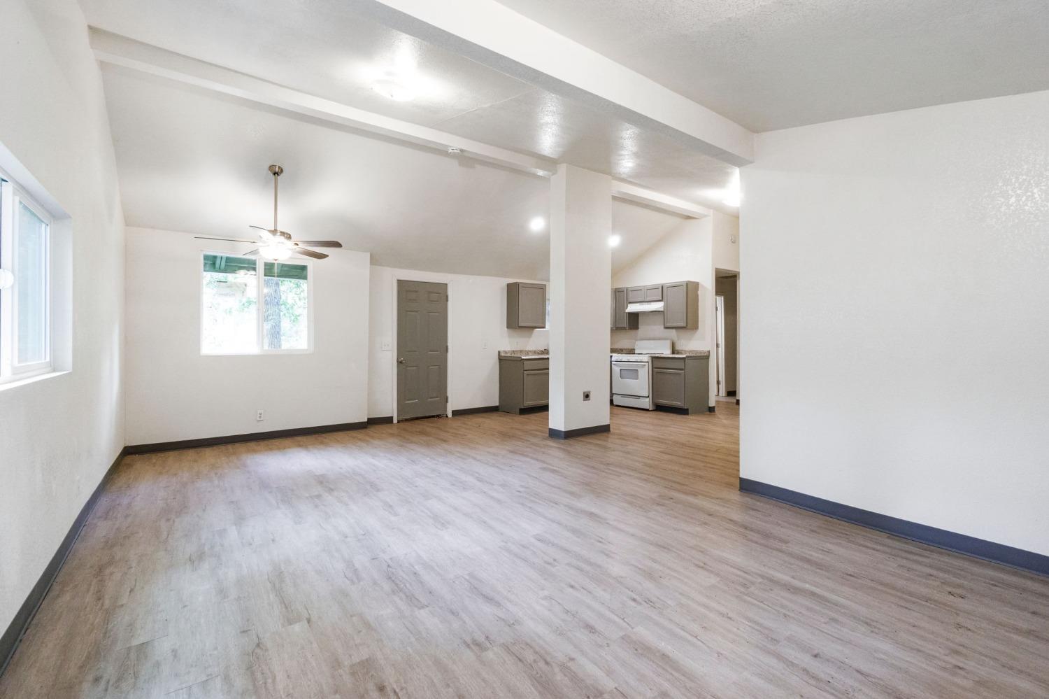 46801 Dunlap Road Miramonte, CA 93641 - Photo 5 of 28 an empty room with wooden floor and windows