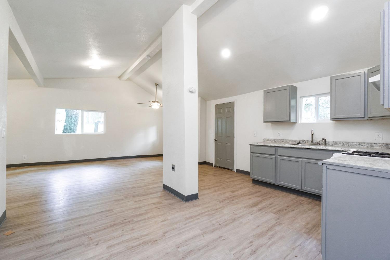 46801 Dunlap Road Miramonte, CA 93641 - Photo 7 of 28 a view of a kitchen with a sink stove cabinets and empty room