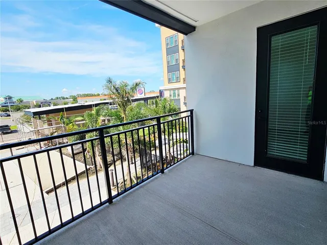 a view of balcony with furniture
