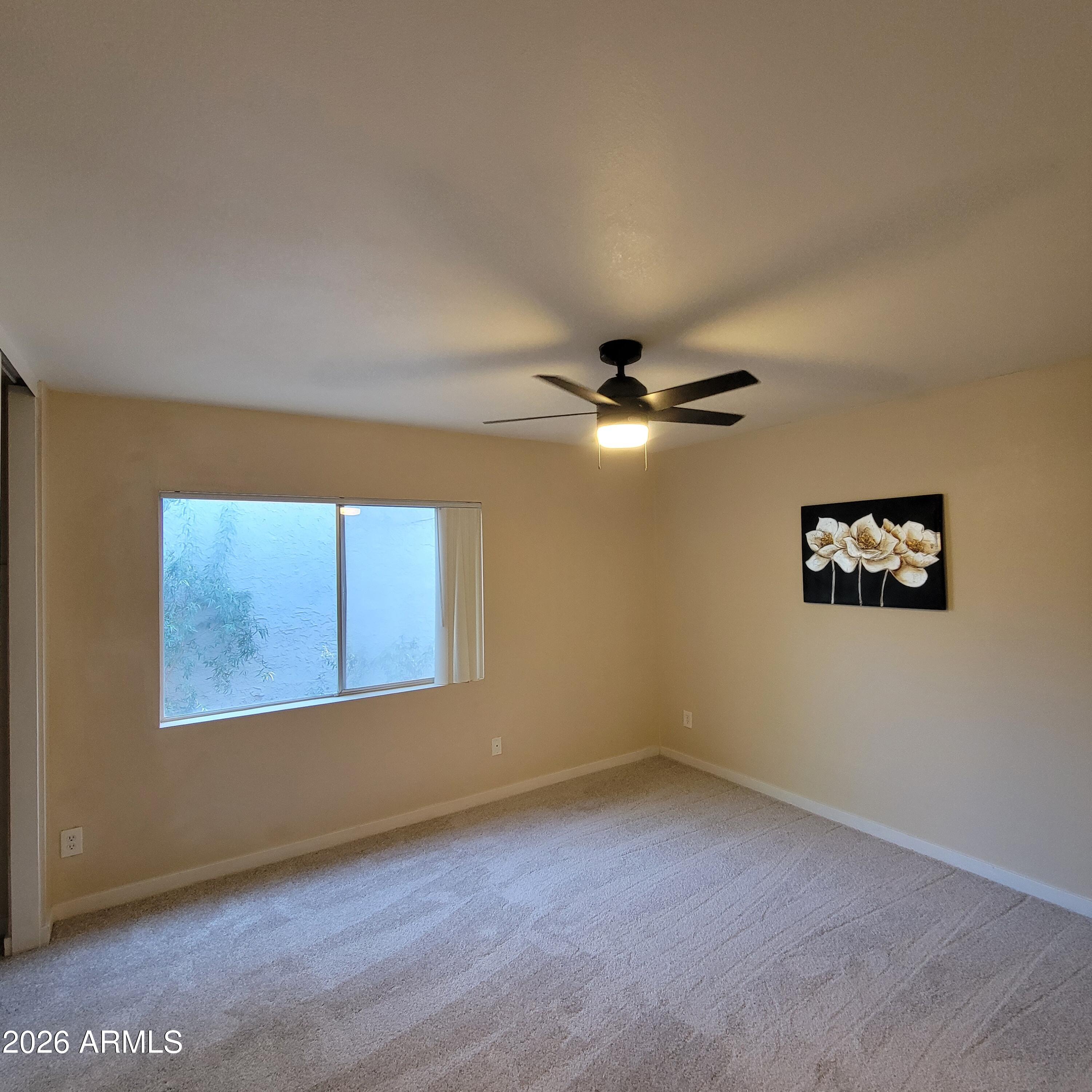 5605 South Spinnaker Road Tempe, AZ 85283 - Photo 14 of 26 an empty room with a window