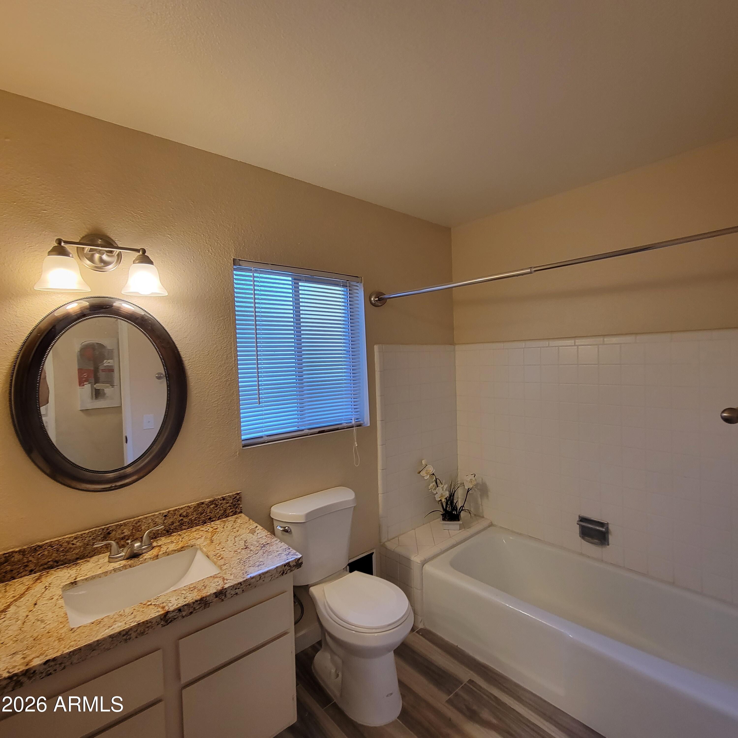 5605 South Spinnaker Road Tempe, AZ 85283 - Photo 16 of 26 a bathroom with a sink and a mirror