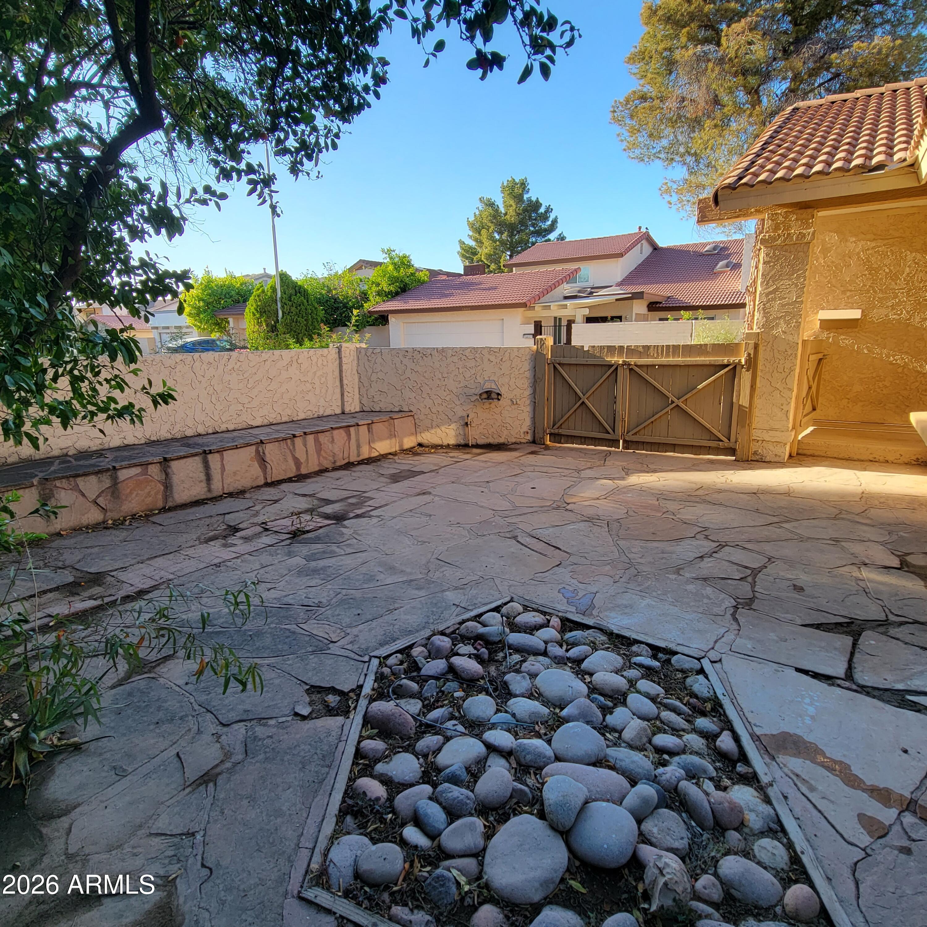 5605 South Spinnaker Road Tempe, AZ 85283 - Photo 18 of 26 a view of a yard with wooden fence