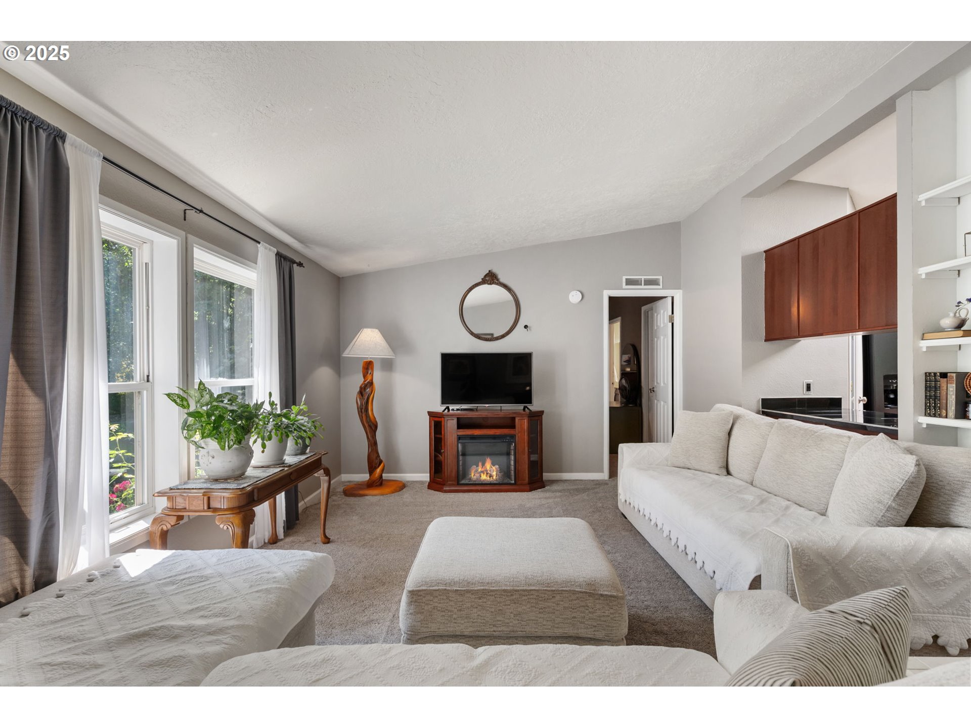 31255 South Kauffman Road Canby, OR 97013 - Photo 7 of 48 a living room with furniture a fireplace and a potted plant