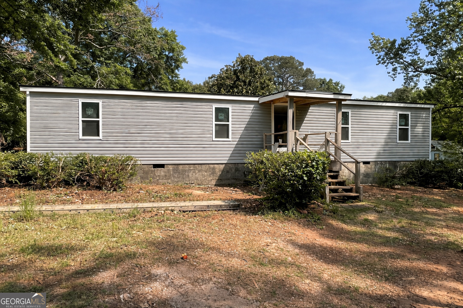 2310 S Highway Forsyth, GA 31029 - Photo 1 of 1 a view of a house with backyard and sitting area
