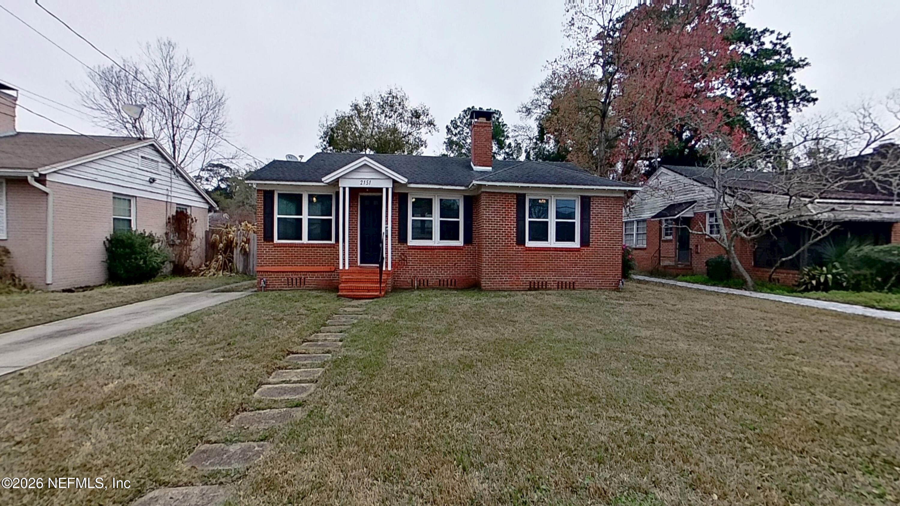 2151 Traymore Road Jacksonville, FL 32207 - Photo 1 of 18 a front view of a house with a yard