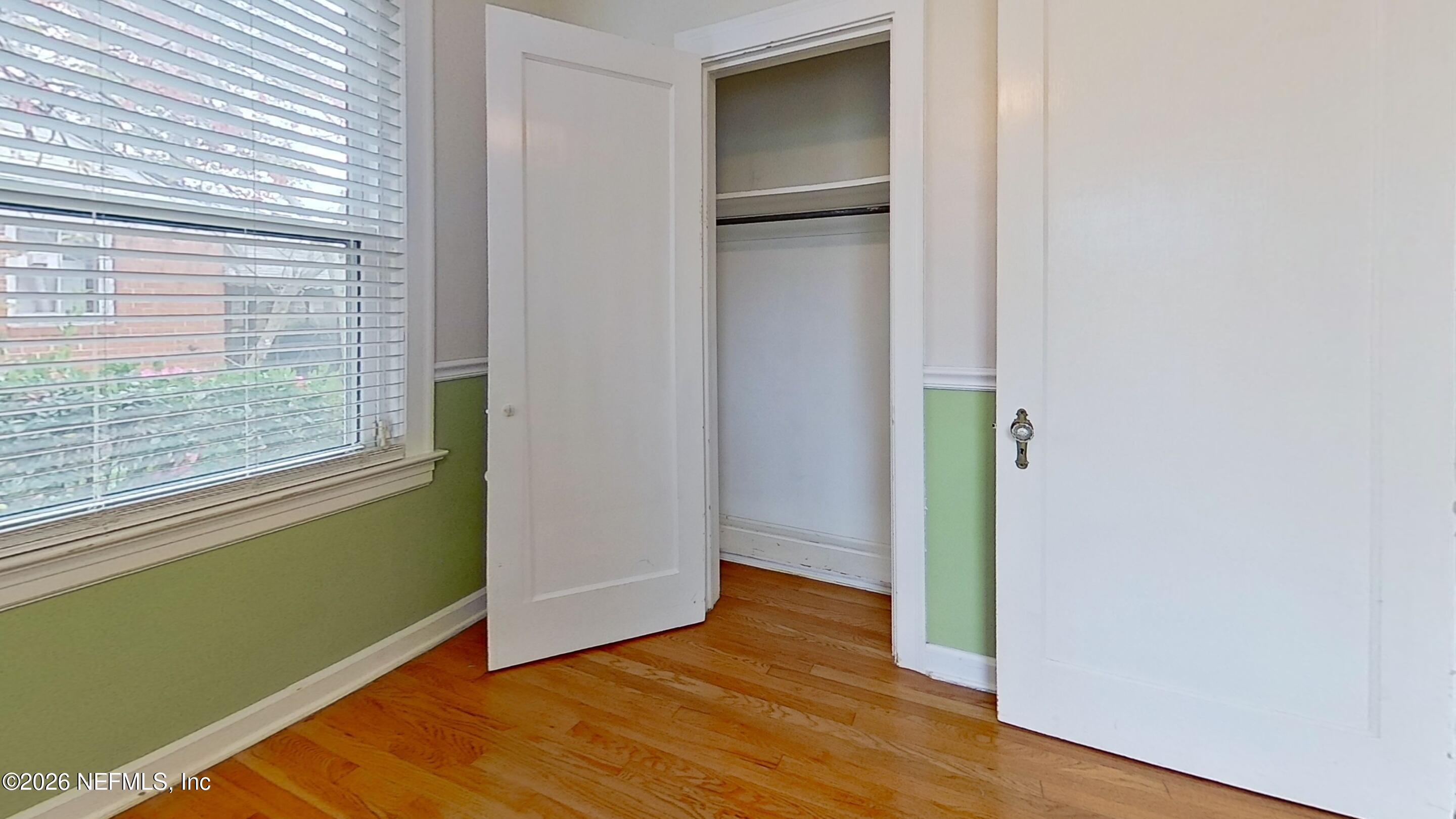 2151 Traymore Road Jacksonville, FL 32207 - Photo 15 of 18 a view of empty room with wooden floor and fan