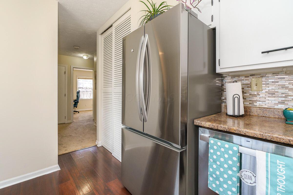 300 Sturbridge Road Columbus, OH 43228 - Photo 16 of 31 3-door stainless steel refrigerator next to double pantry