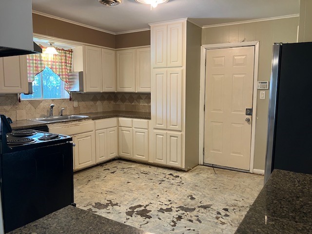 407 Wilson Road Conroe, TX 77301 - Photo 6 of 24 Plenty of space for cabinets in this kitchen. Door leads to the garage.