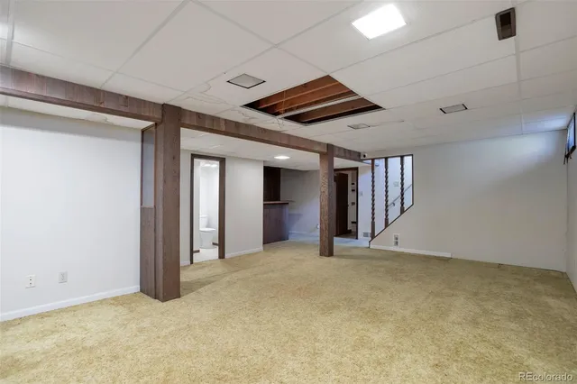 a room with furniture and a kitchen