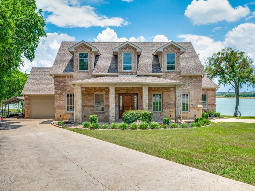 5975 Diamond Spur Frisco, TX 75036 - Photo 2 of 40 a front view of a house with a yard
