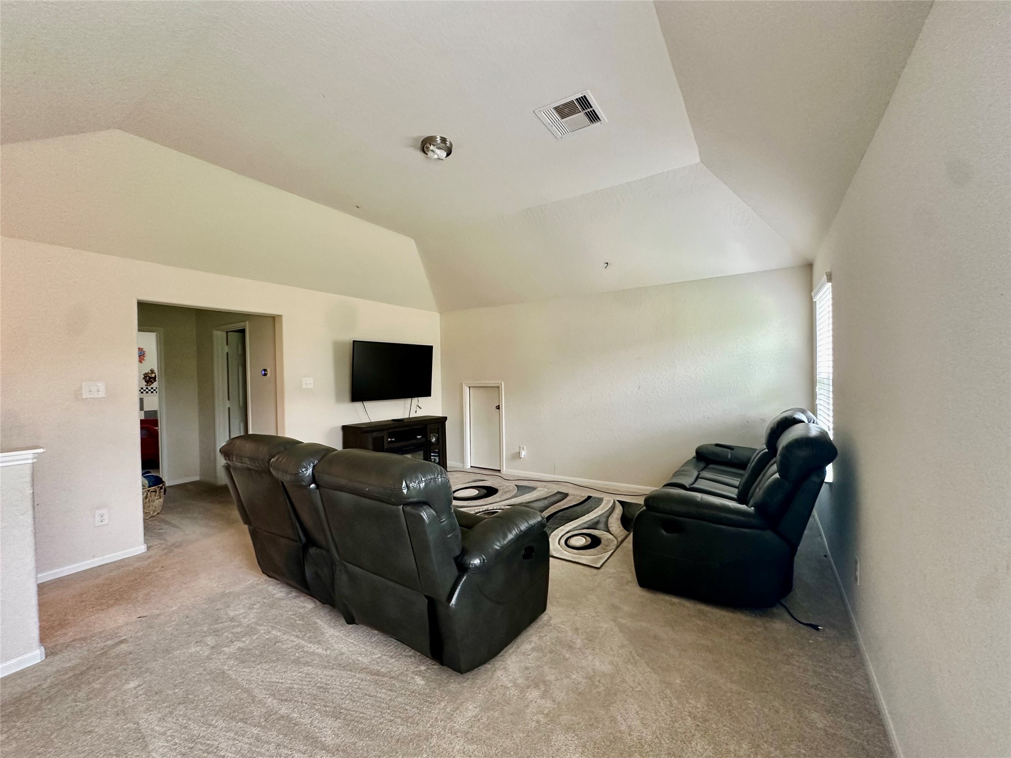 18622 Each Elm Way Houston, TX 77084 - Photo 26 of 35 a living room with furniture and a flat screen tv