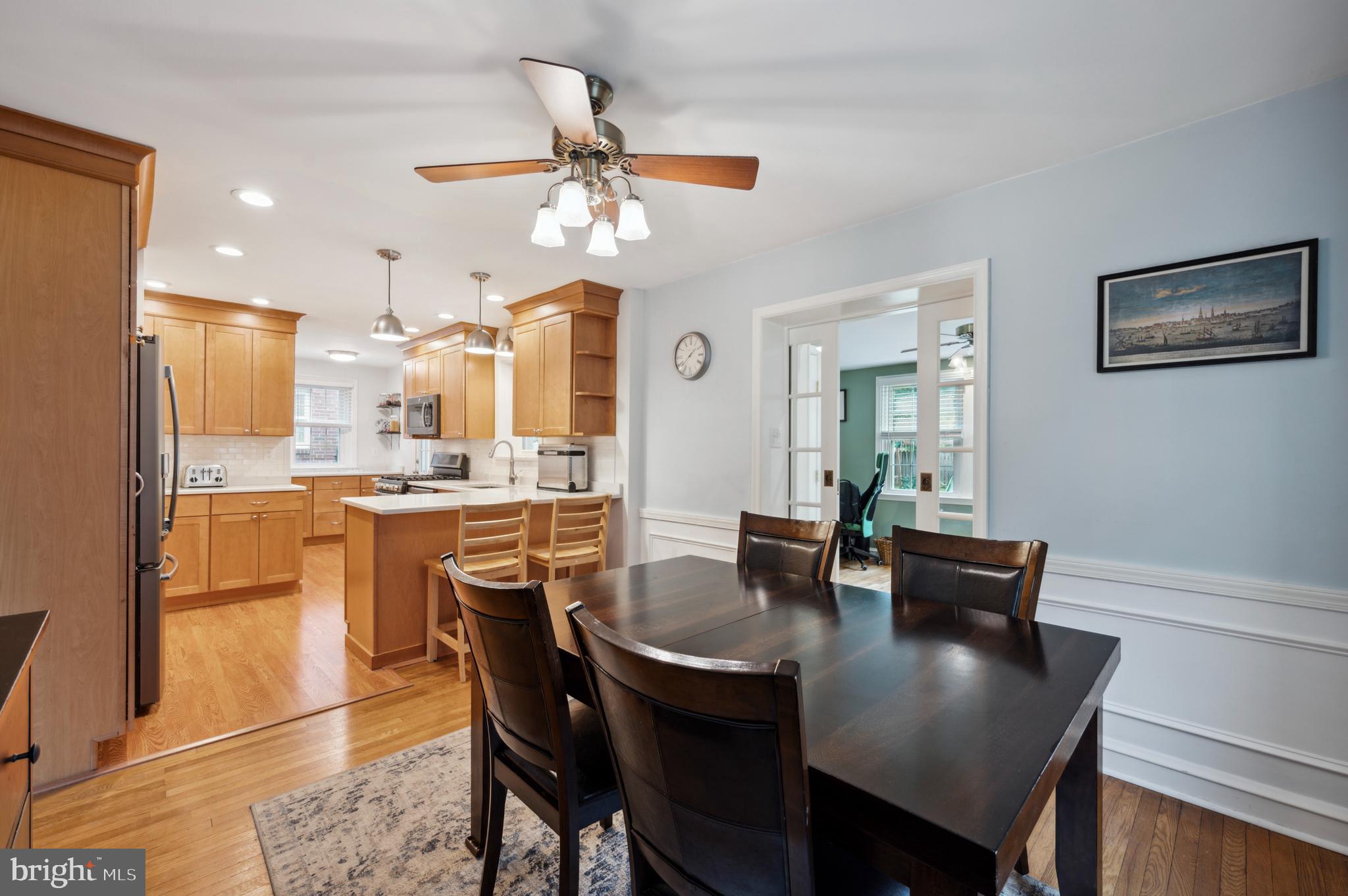 415 Upland Road Havertown, PA 19083 - Photo 8 of 26 a dining room with stainless steel appliances kitchen island granite countertop a dining table chairs and a refrigerator