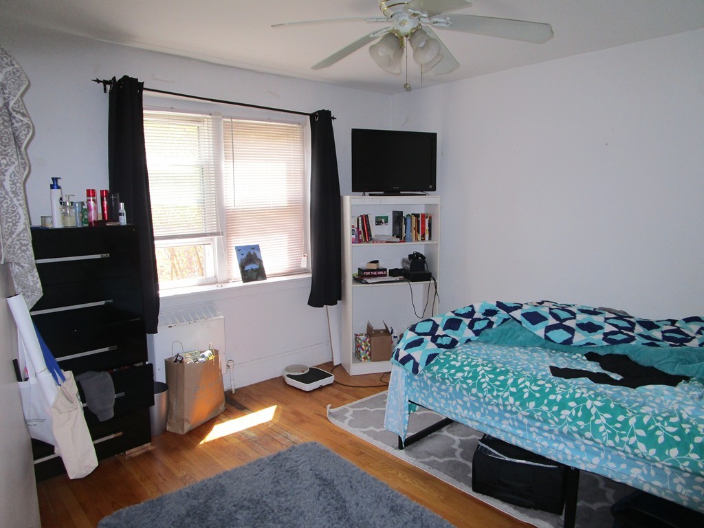6 O'Leary Way, Unit 82 Boston, MA 02130 - Photo 10 of 14 a living room with furniture and a flat screen tv