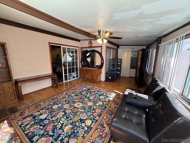 a bedroom with furniture and a window