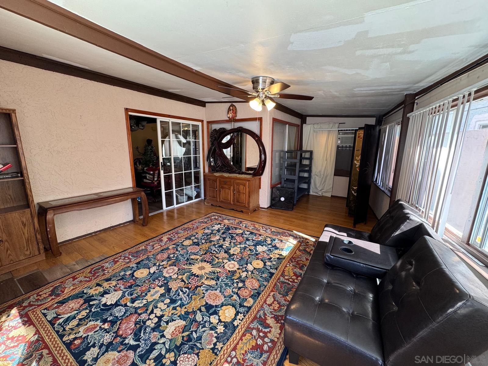 a bedroom with furniture and a window
