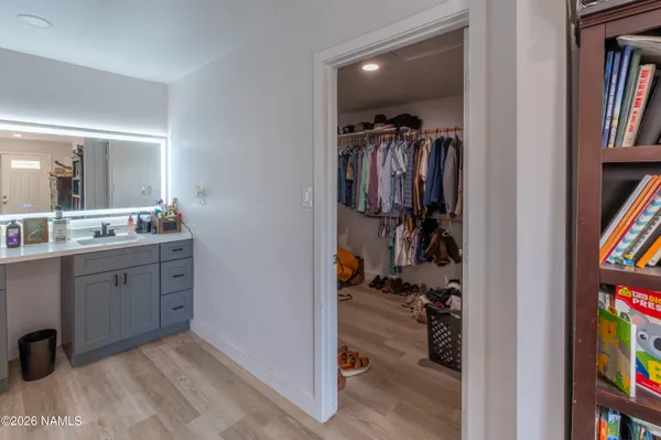 a view of a walk in closet and bathroom