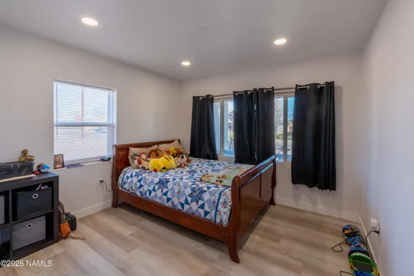 a bedroom with a bed and a closet