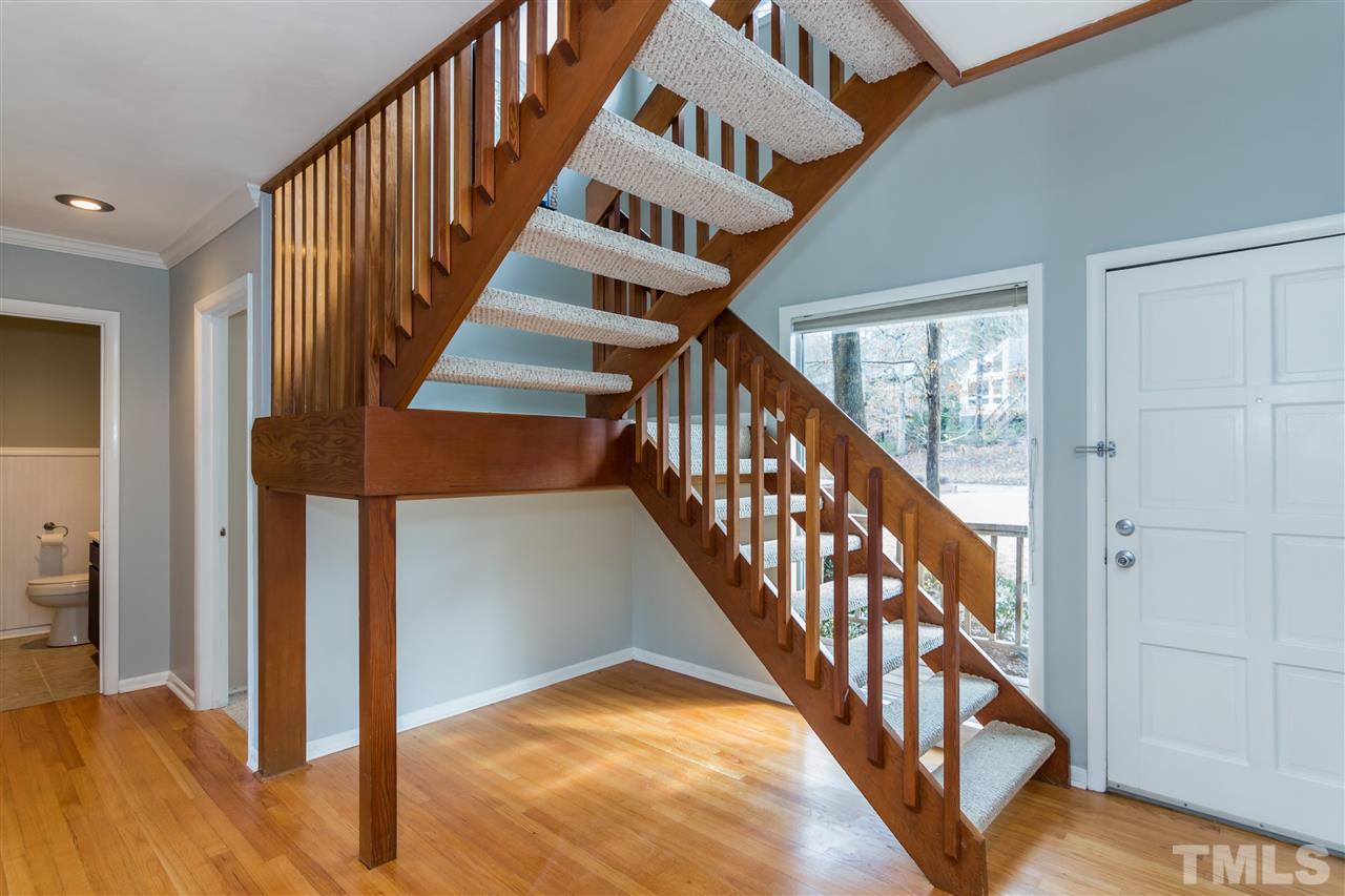5 Sandstone Ridge Drive Durham, NC 27713 - Photo 2 of 25 a view of staircase with wooden floor and white walls